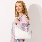 Sac bandoulière double pompon en cuir - Le Jumeau