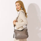 Sac bandoulière double pompon en cuir - Le Jumeau