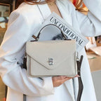 Sac bandoulière cartable femme en cuir grainé