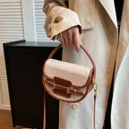 Sac bandoulière demi-lune en toile et cuir