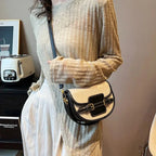 Sac bandoulière demi-lune en toile et cuir