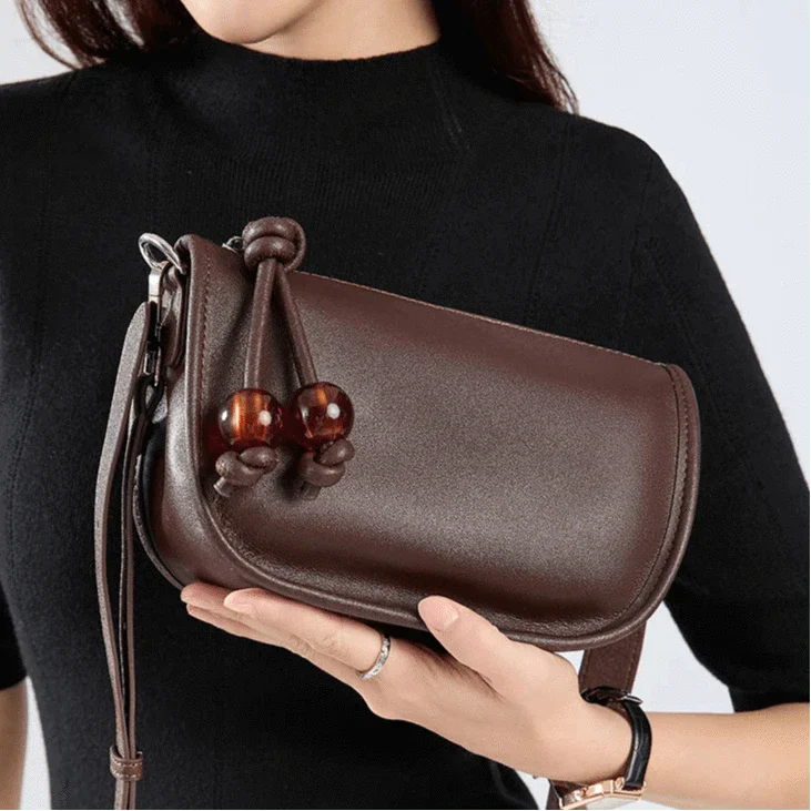 Sac bandoulière en cuir à perle rouge