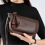 Sac bandoulière en cuir à perle rouge