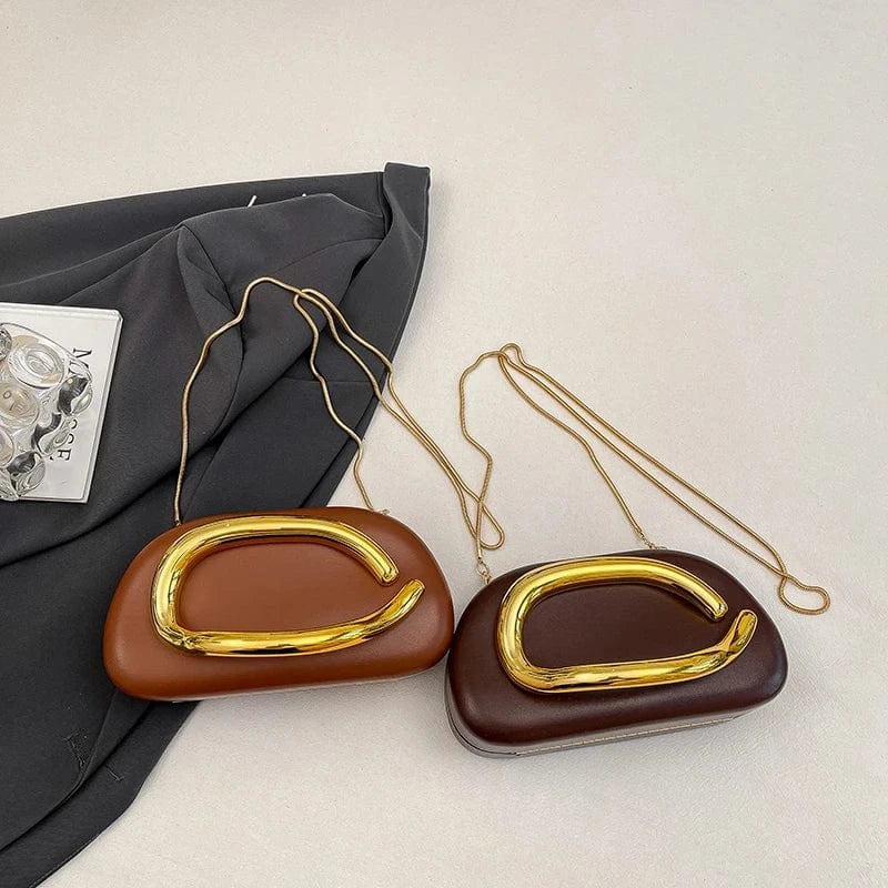 Sac bandoulière original avec ornement doré